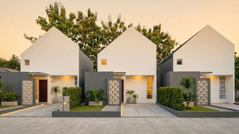 Deretan rumah modern dengan taman depan
